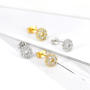 Detail showing s925 stamp on silver and gold geometric stud earrings with zircons