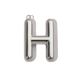 Detailed view of a mirror polished silver 3D hollow letter H pendant with balloon effect