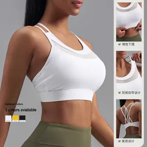 Soutien-gorge de sport blanc avec empiècements en mesh, dos croisé et bande élastique