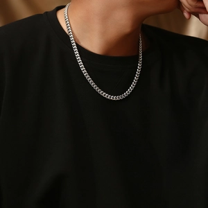 Classic silver titanium steel Cuban chain necklace worn by a professional model