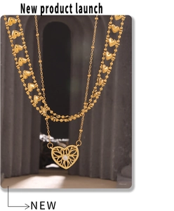 Detail of gold layered heart necklace with hollow pendant and sparkling zircon inlay