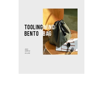 Detail of army green bento bag with durable canvas texture on a rustic wooden background