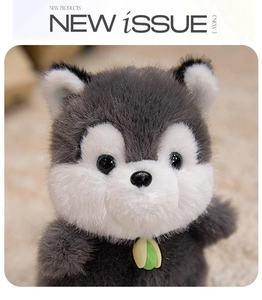 Close-up of plush husky charm with soft grey fur and a yellow water drop accessory