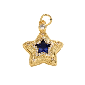 Gold star necklace pendant with deep blue gemstone and sparkling zircon crystals