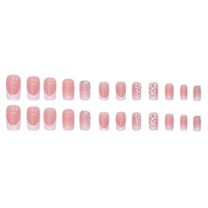 Pink and white gradient French press-on nails with white flower patterns and rhinestones