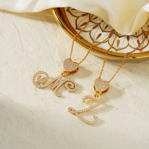 Golden alphabet M and L pendant necklace with heart-shaped zircon inlay and fine cross chain