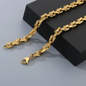 Macro shot of gold-plated stainless steel mesh chain with durable lobster clasp detail