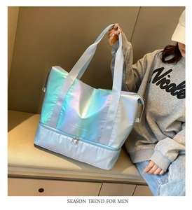 Holographic travel bag detail showing the bottom dry-wet separation compartment and iridescent finish