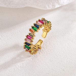 Luxury 18K gold plated open ring featuring colorful zircon stones on a white stone background