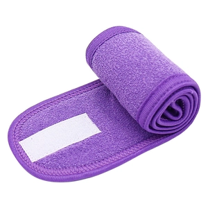 Soft purple plush spa headband with adjustable velcro closure for skincare and makeup