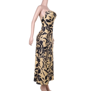 Detail of sexy backless floral dress with yellow and black print on silk fabric