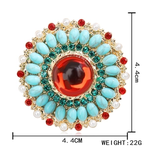 Vintage bohemian flower brooch with red gem and turquoise beads on gold metal base