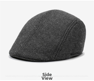 Detailed side view of a classic grey herringbone newsboy cap for men in winter