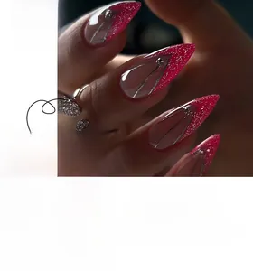 Detailed view of pink glitter almond press-on nails with silver geometric line accents