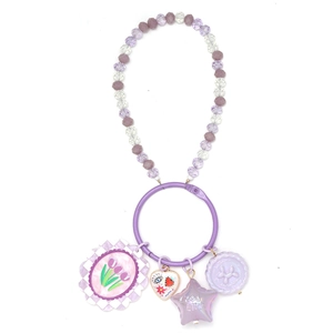 Detail of purple beaded keychain with tulip flower and Good Luck star charm pendants