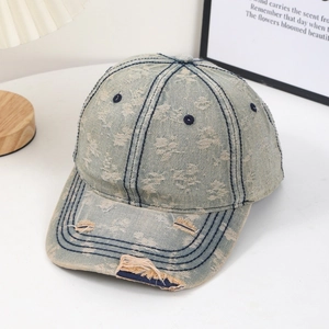 Vintage light blue washed denim baseball cap with distressed brim and six-panel design