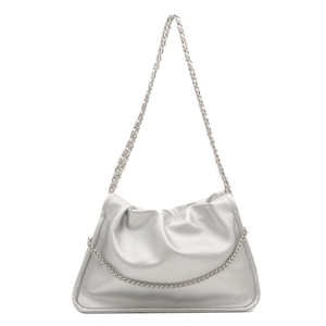 Silver metallic cloud clutch bag with chain strap and soft pleated texture on white background