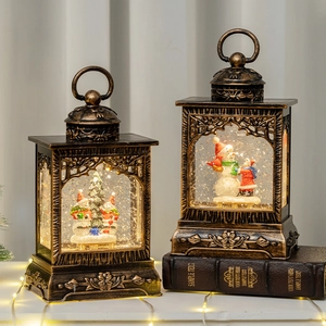 Vintage bronze Christmas lantern with LED light, snowman and tree scene inside