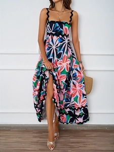Detailed view of bohemian floral maxi dress featuring black scalloped shoulder straps