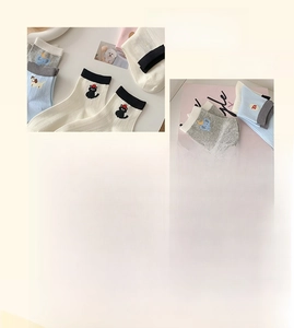 Detail of combed cotton ankle socks featuring cute animal embroidery and ribbed cuffs