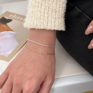 Elegant gold and silver S925 sterling silver star chain bracelets worn together