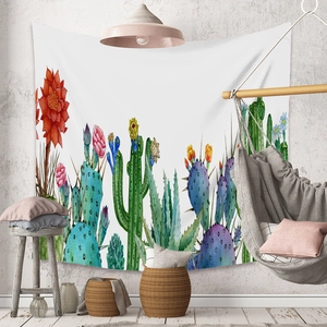 Detailed close-up of bohemian cactus watercolor tapestry hanging in a cozy room decor