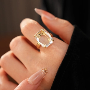 Close-up of a 14k gold plated ring with a large emerald-cut cubic zirconia stone