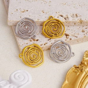 Detailed view of irregular 304 stainless steel rose flower pendants in gold and silver finish