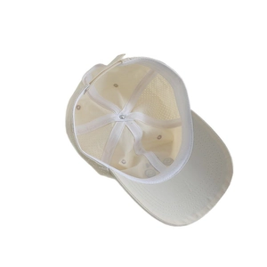 Kids quick dry baseball hat in cream white featuring breathable holes and adjustable strap
