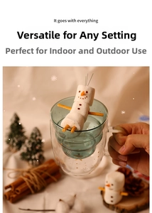 Festive double-wall glass with golden snowflakes and snowman marshmallow hot drink