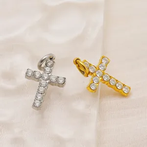 Sparkling diamond-encrusted cross pendants in gold and silver finish on silk fabric