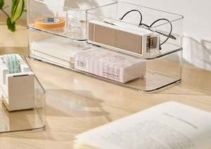 Detail of stackable clear acrylic drawer organizers with smooth rounded corners