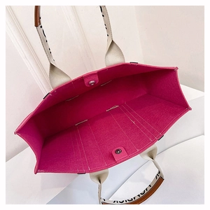 Top view of large rose pink felt tote bag showing spacious interior and snap closure