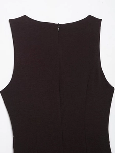 Detail shot of the back neckline featuring a smooth invisible zipper on a dark dress