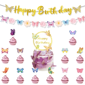 Detail of purple butterfly party decorations with gold Happy Birthday banner and cake toppers