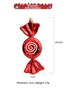 Detail of red candy Christmas ornament with white swirls, showing 19.3cm height dimension