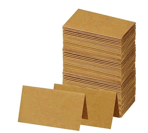 Detailed view of stacked kraft paper place cards with blank foldable design for weddings