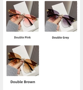 Detail of rimless gradient sunglasses featuring gold metal accents and irregular cut lenses