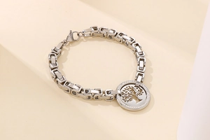 Detailed close-up of a silver tree of life bracelet with sparkling crystal rhinestones