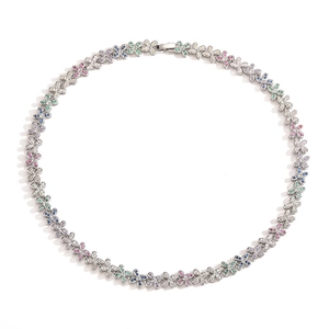 Detailed view of silver butterfly necklace featuring colorful inlaid crystals on white background