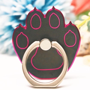 Macro shot of bear paw metal ring holder with black and pink accents for phones
