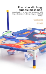 Detail of indoor tossing game board with scoring nets and colorful plastic rings for kids
