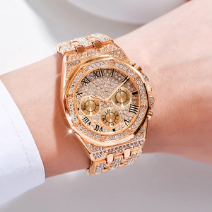 Luxury rose gold quartz watch with full crystal pavé and octagonal bezel on wrist