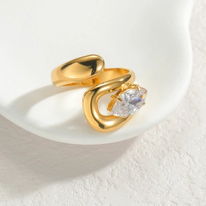 Asymmetrical gold open ring featuring a sparkling marquise-cut zircon gemstone