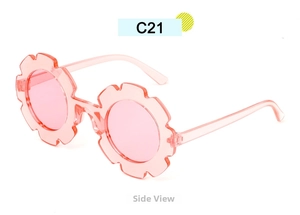 Side view of pink flower-shaped sunglasses for kids with transparent finish and petal frame