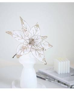 Detailed view of champagne mesh Christmas flower with gold sequins for tree decoration