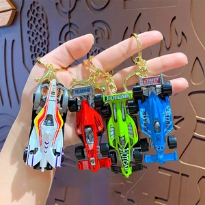Mini F1 racing car keychains in white, red, green, and blue with durable metal rings