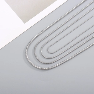 Set of four silver stainless steel snake bone necklaces in various lengths and thicknesses