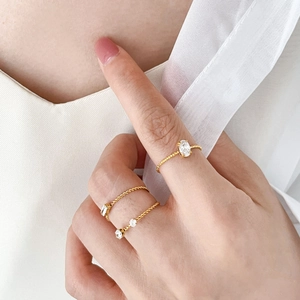 Three-piece stackable 18K gold plated twisted band rings with cubic zirconia stones