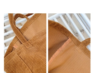 Detail of caramel corduroy tote bag showing reinforced stitching and fabric texture